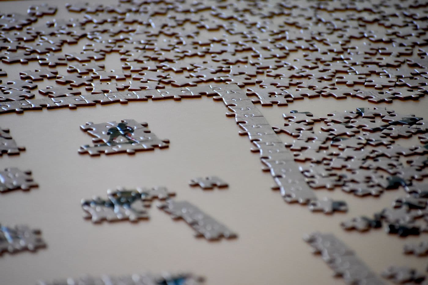 Incomplete jigsaw puzzle symbolizing fragmented systems and complex workplace problems